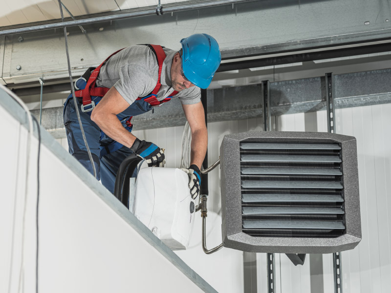 Technician Working on HVAC Fire Suppression System