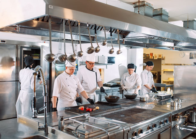Chefs Cooking in a Commercial Kitchen